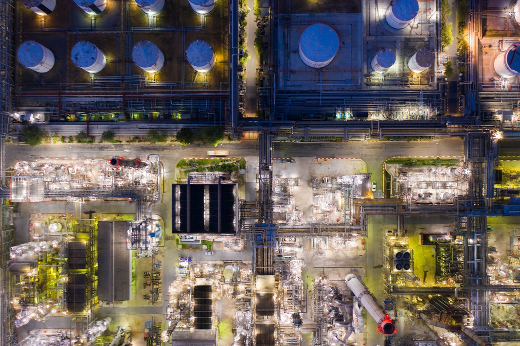 An aerial view of a refinery at night